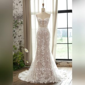 A BRIDAL MERMAID GOWN WITH CORSET BODICE AND BEADED SPAGHETTIS